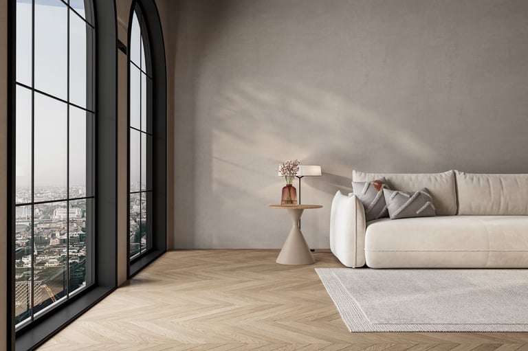 Luxury minimalist living room with arched windows, beige sofa, and natural daylight over herringbone wood floor. 3D rendering